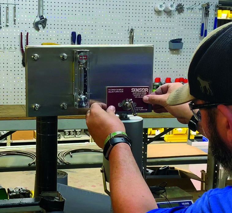 SENSOR Employee working in the plant.